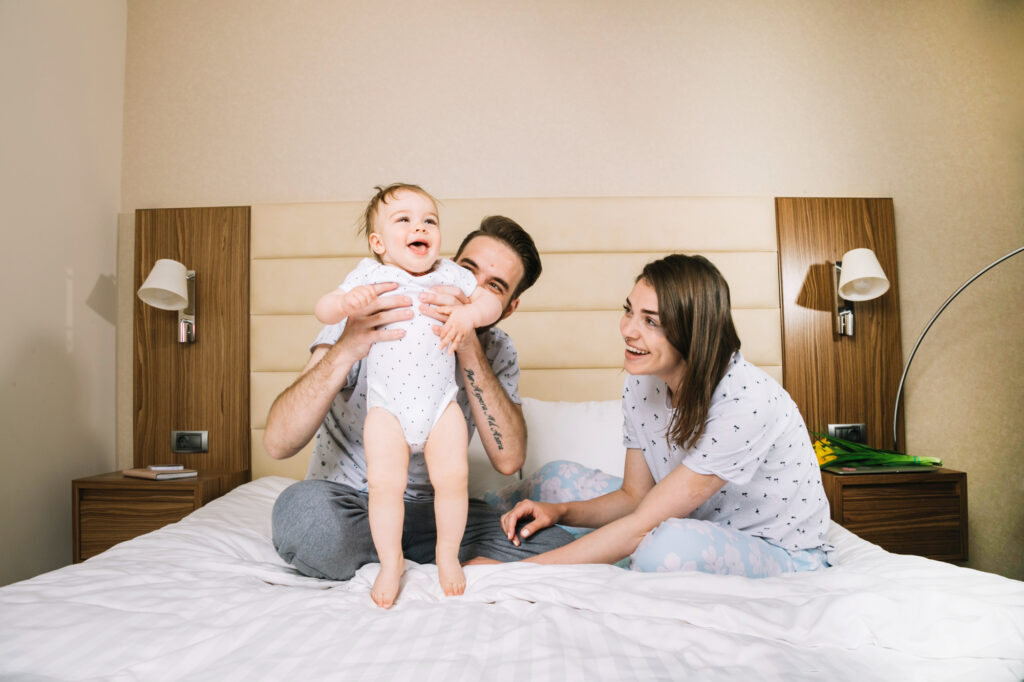 Family playing together on the (emBrace)® 360 Platform Bed.